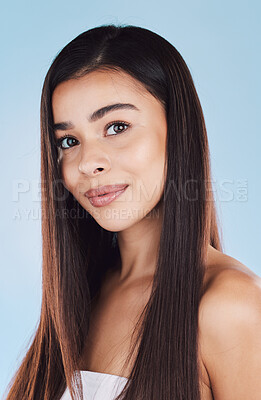 Buy stock photo Girl, hairstyle and cosmetics in studio portrait with pride, confidence and growth by blue background. Woman, person and model with hair care, change and transformation with results in Colombia