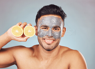 Buy stock photo Man, lemons and face mask for skincare, dermatology and organic cleaning on studio background with smile. Male person, portrait and charcoal facial for skin texture or hydration with natural cosmetic