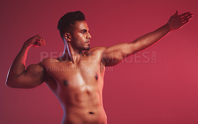 Buy stock photo Fitness, muscle and man on red background with flex for health, stretching and strength in studio. Workout, bodybuilder and isolated person with strong body for exercise, training and wellness