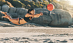 Volleyball, sports game and woman on the beach in a bikini while on holiday in Mexico in summer. Jump for African girl on vacation by ocean and playing in sport competition with energy during travel