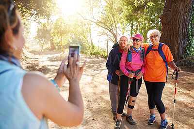 Buy stock photo Phone, photograph senior women hiking group in forest on summer holiday weekend. Nature, elderly female friends and walk on adventure trail. Friendship, fun and fitness on retirement hike in forest.