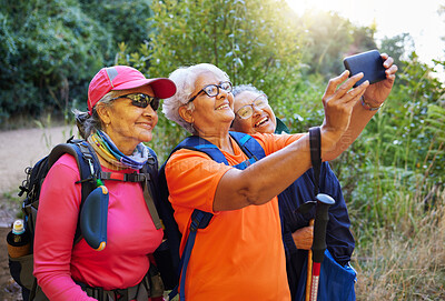 Buy stock photo Senior women, phone selfie and hiking in nature on holiday or summer vacation. Travel, hike and retired friends spending time together on 5g mobile tech, happy memory or picture post for social media