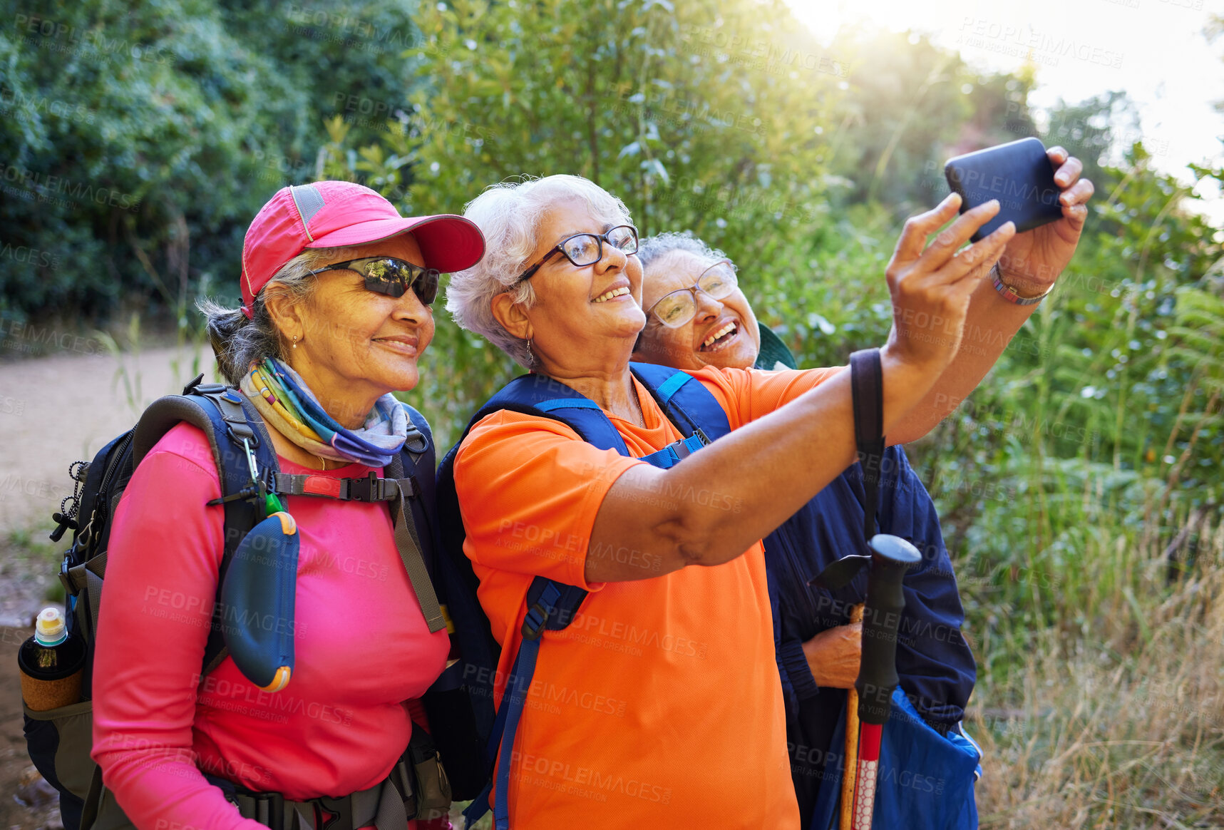 Buy stock photo Senior women, phone selfie and hiking in nature on holiday or summer vacation. Travel, hike and retired friends spending time together on 5g mobile tech, happy memory or picture post for social media