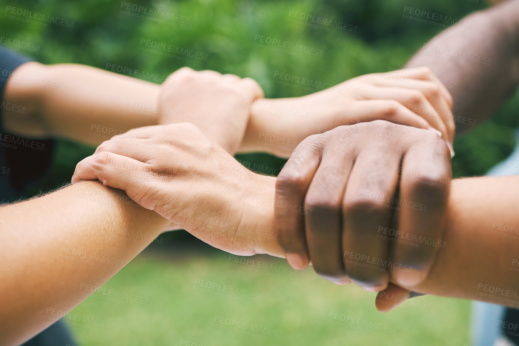 Buy stock photo Hands on wrists, diversity and people in park for support, connection and collaboration in nature. Friends, volunteer group and closeup of arms link for teamwork, community and solidarity outdoors