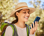 Woman, outdoor and hiking, smartphone for communication and travel, happy outside in nature park. Young, active lifestyle and technology, check map for trail, adventure in forest and 5g network.