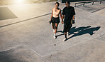 Couple, holding hands or walking on skatepark date in fun fitness, skating exercise or love bonding. Smile, happy man or skater woman and skateboard, edgy or fashion clothes in Brazilian summer break