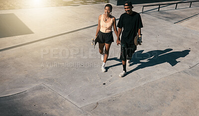 Buy stock photo Couple, holding hands or walking on skatepark date in fun fitness, skating exercise or love bonding. Smile, happy man or skater woman and skateboard, edgy or fashion clothes in Brazilian summer break