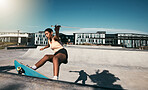 Fitness, girl and skateboarder skateboarding in a skate park for training, cardio workout and sports exercise. New York, skater and urban city black woman skating outdoors in summer for practice 