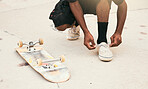 Skater, shoes and tie laces with skateboard in park for safety, speed and skating outdoor in sunshine. Man, sneakers and shoelaces on feet, ground and skatepark in summer for fitness, sport and fun