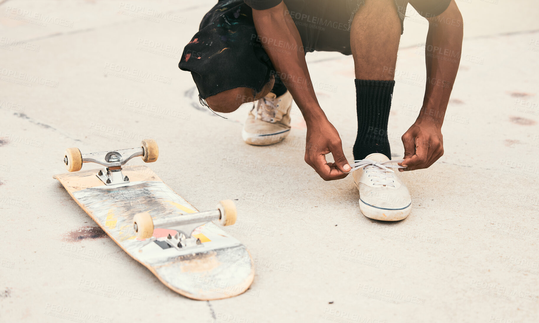 Buy stock photo Skater, shoes and tie laces with skateboard in park for safety, exercise and skating outdoor in city. Man, sneakers and shoelaces on feet, ground and skatepark in summer for fitness, sport and fun