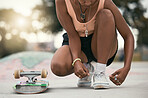 Skater, shoes and tying laces with skateboard in park to skate for fun, exercise and training outdoors. Fitness, woman athlete and sports sneakers on feet in park during summer vacation or adventure.