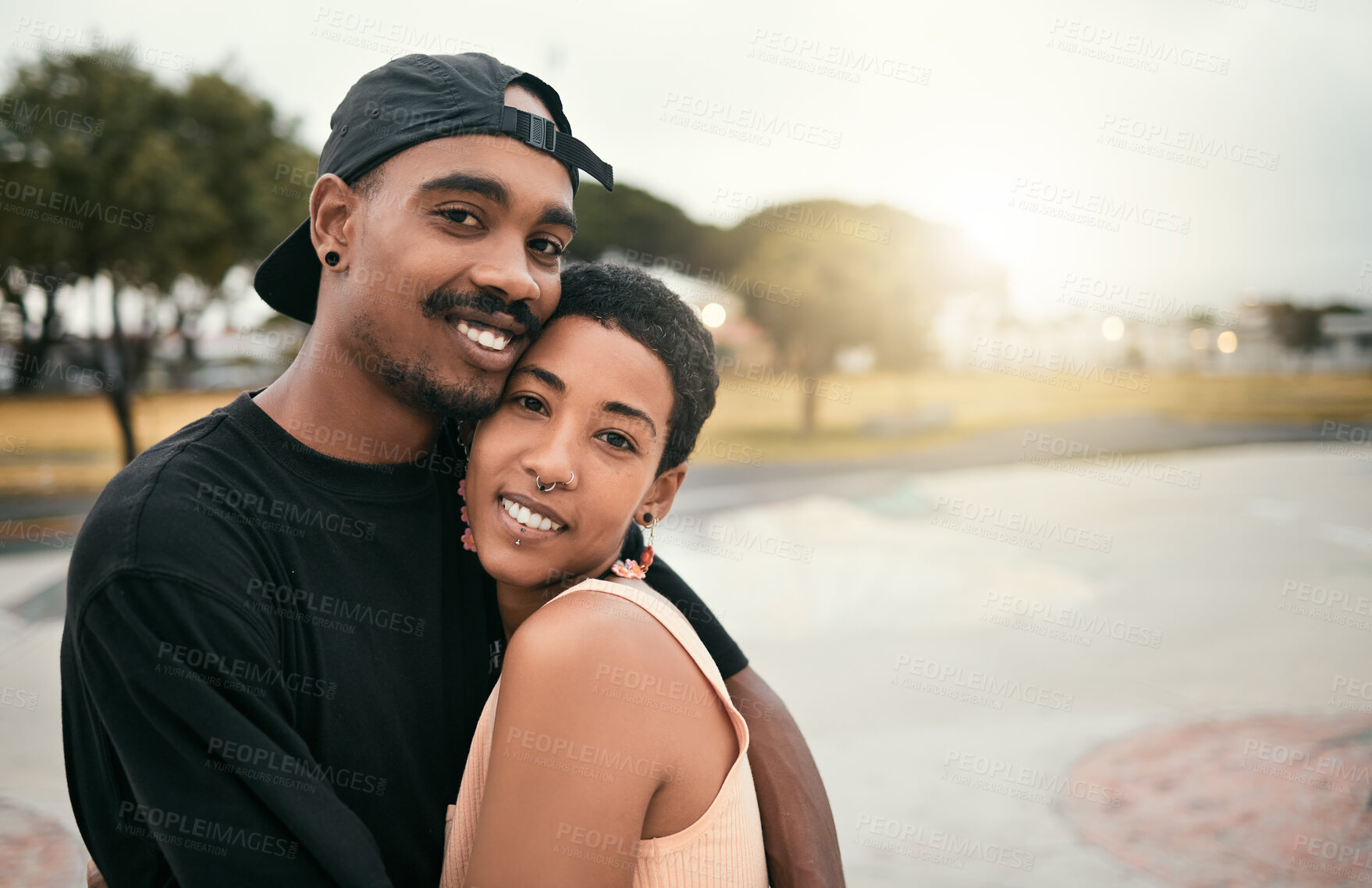 Buy stock photo Skate, love and portrait of black couple hug in city enjoying weekend, free time and summer. Skating, trendy fashion and young black man and woman in relationship, dating and embrace in skate park