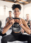 Kettlebell, fitness and black woman gym personal trainer with sport class doing gym training. Portrait of an exercise coach with sports student doing a wellness, strong and body workout with focus