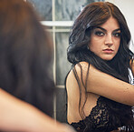 Fashion, lingerie and beauty with a model woman getting ready using a closet mirror in her home. Sexy, lace and underwear with an attractive young female posing while dressing alone in a house