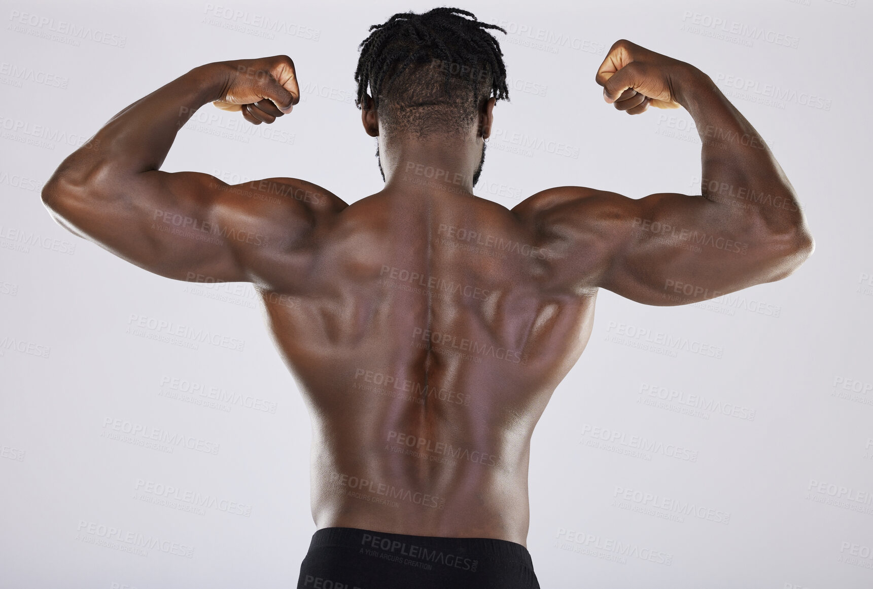 Buy stock photo Flexing, arms and back of a black man with muscle isolated on a grey studio background. Fitness, sexy and strong body of an African bodybuilder showing strength from gym exercise on a backdrop