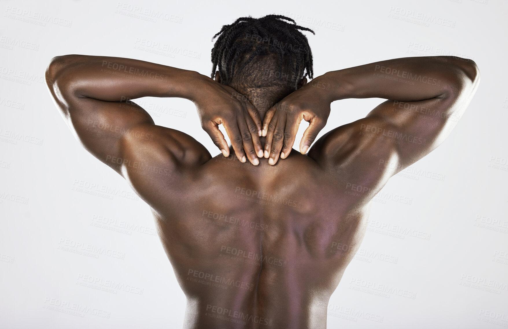 Buy stock photo Back, body and muscular with a model black man posing in studio on a gray background for fitness or exercise. Muscle, health and wellness with a strong male athlete posing or flexing for power