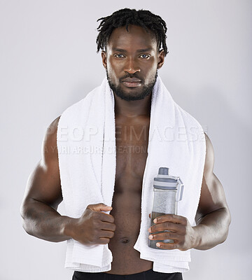 Buy stock photo Black man, towel and water for fitness portrait of sports person in studio for strong body. Health and wellness of sexy male bodybuilder model after exercise, workout and power training with a bottle