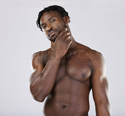 Buy stock photo Thinking, portrait and black man in studio for wellness, grooming and hygiene on grey background. Muscular, man and beauty routine on mockup, relax and skincare treatment on shirtless model isolated