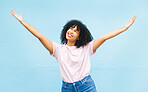 African woman, smile and open arms in studio for mockup, happiness celebration and excited in blue background. Black woman, happy and surprised hands gesture or celebrate surprise growth development