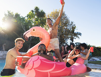 Buy stock photo Pool party, beer and friends on flamingo, having fun and partying. Summer celebration, water event and group portrait of drunk funny people laughing with alcohol, swimming and floating on bird float.