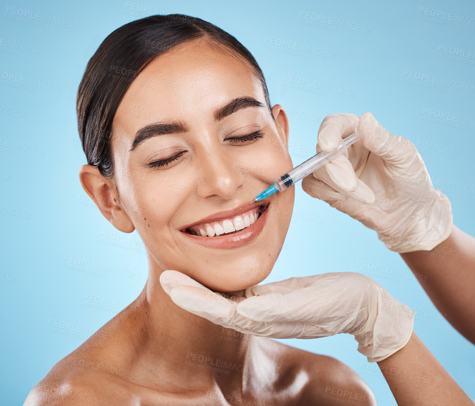 Buy stock photo Filler, woman and plastic surgery on lips with needle, skincare or beauty clinic in studio. Derma, face injection and aesthetic cosmetics for happy transformation, change and smile on blue background