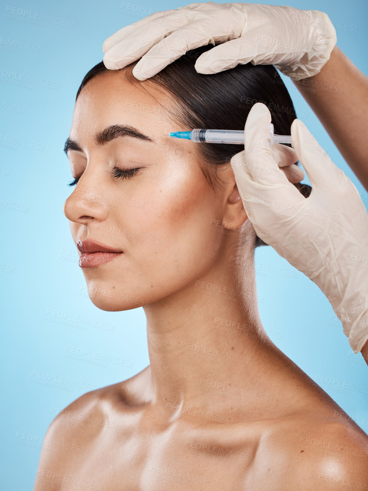 Buy stock photo Skincare, filler and woman in a studio with beautician for face enhancement, cosmetic or plastic surgery treatment. Beauty, cosmetology and female model getting facial injection by a blue background.