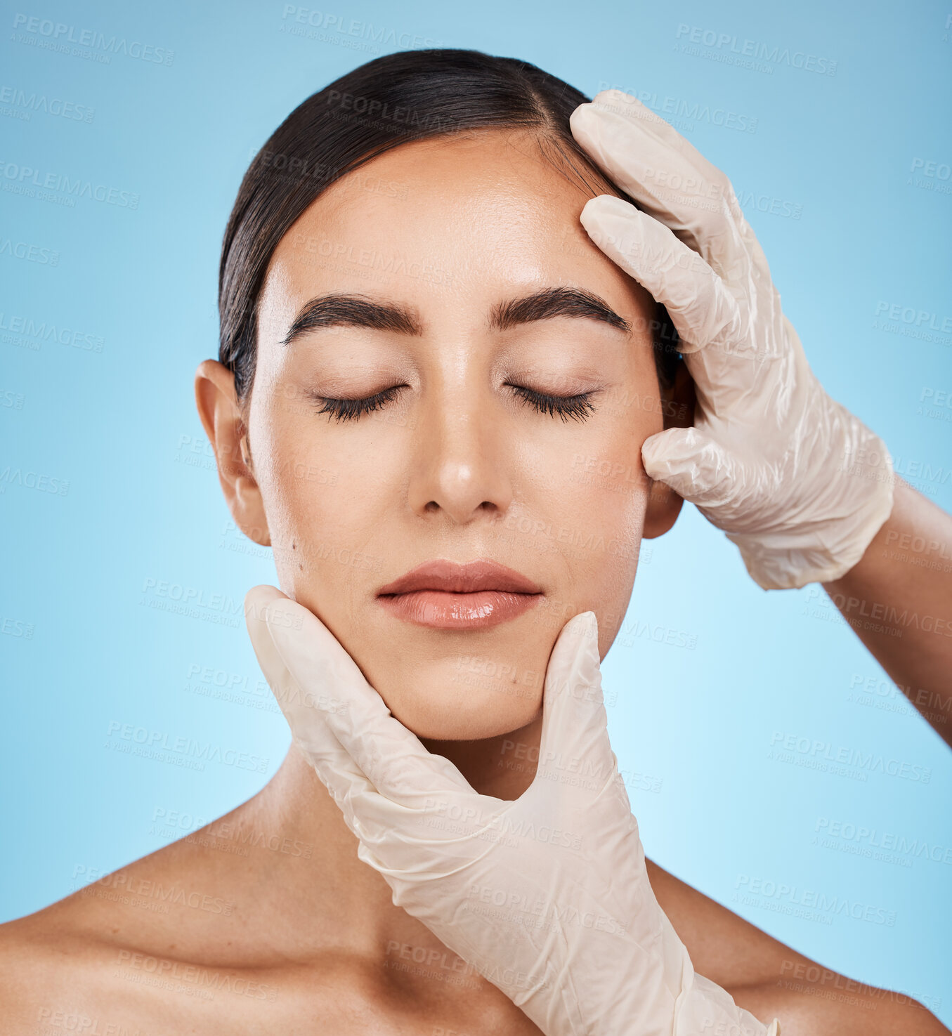 Buy stock photo Cosmetics, plastic surgery and hands check woman face for laser, implant or beauty salon. Skincare consultation, facial or gloves for aesthetic change, liposuction and filler on blue background