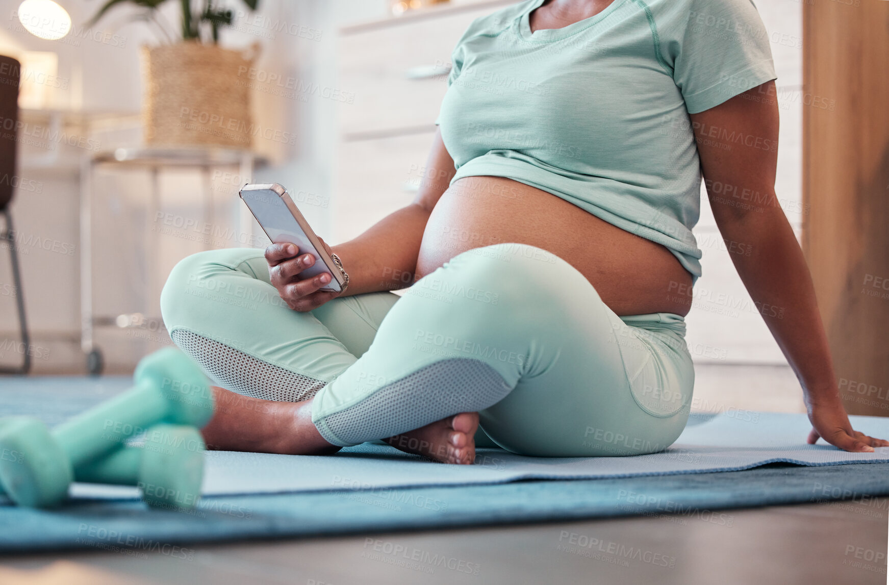 Buy stock photo Yoga, pregnant black woman and hands with phone for social media and texting on workout break. Pregnancy, zen pilates and female with mobile smartphone for web browsing or scrolling after training.