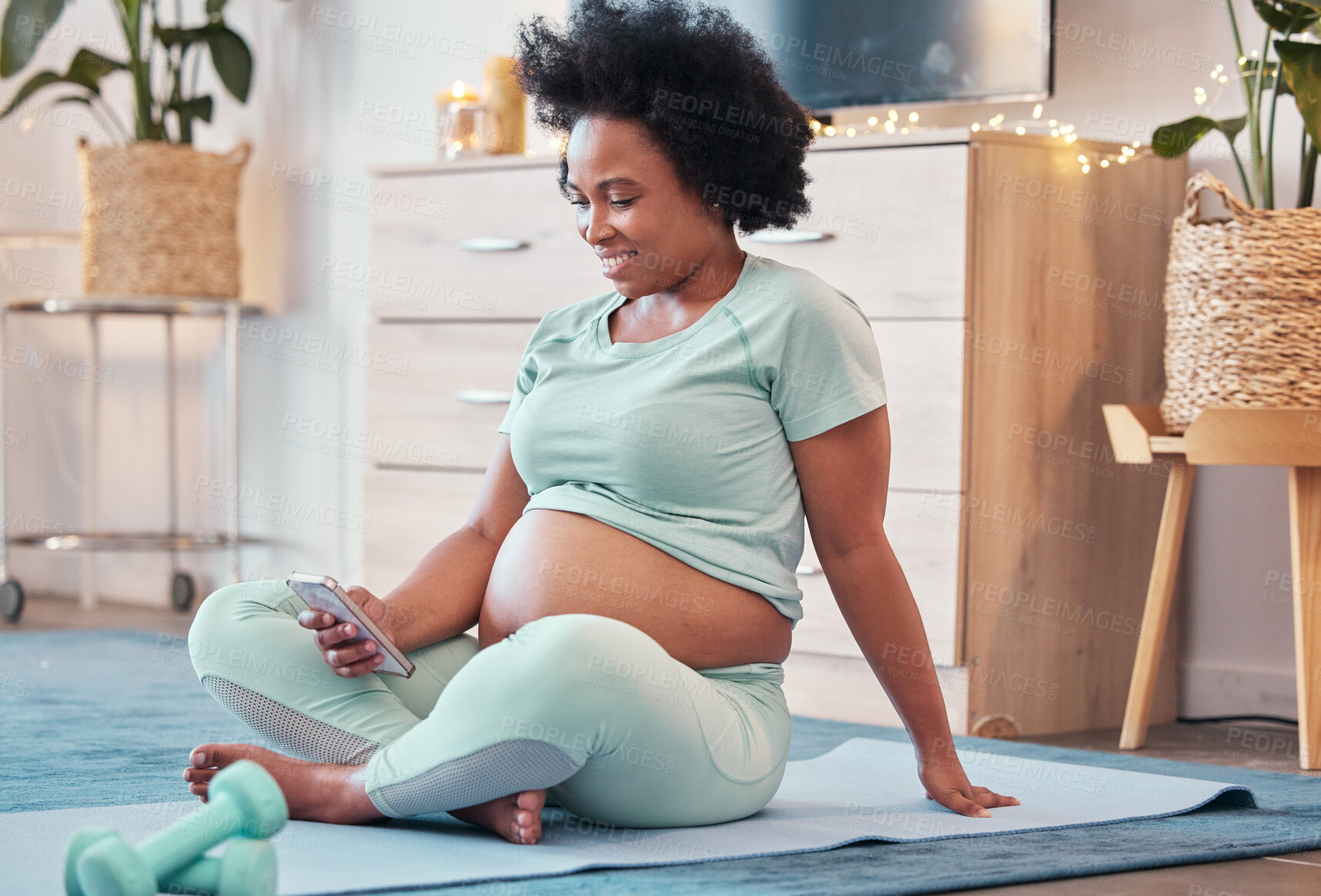 Buy stock photo Yoga, pregnant and black woman with phone in home for social media and texting on workout break. Pregnancy, zen pilates and female with mobile smartphone for web browsing or scrolling after training.