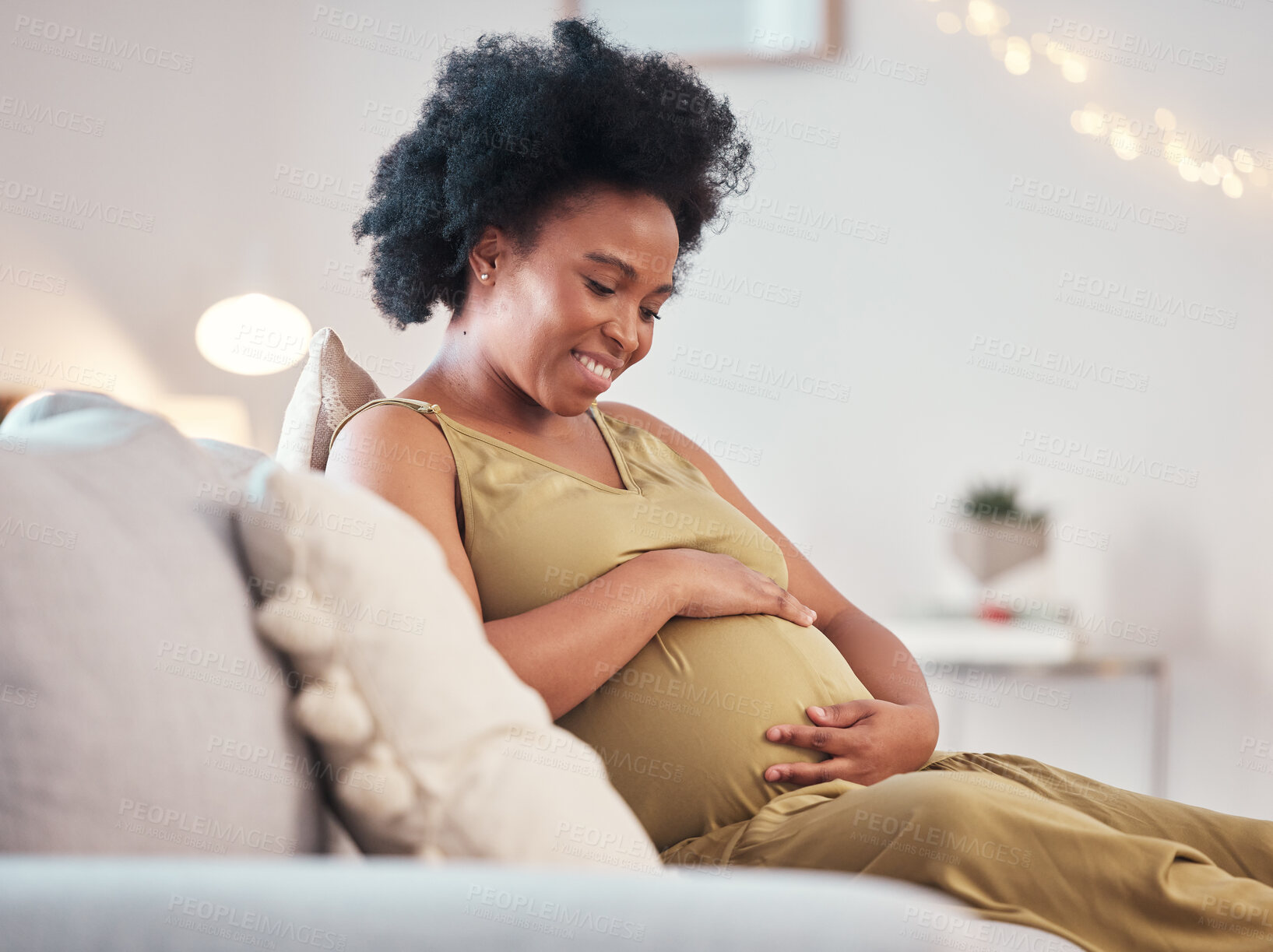 Buy stock photo Pregnant, love and black woman on sofa in home with hope and care for unborn baby. Pregnancy, prenatal motherhood and mama or future mother relax in living room and touching belly for infant health.