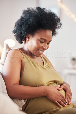 Buy stock photo Pregnant, heart hands and black woman stomach with hand sign feeling mother love. Mom care, sofa and living room lounge with person holding abdomen happy about pregnancy and baby on a house couch