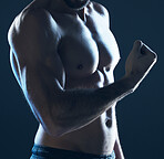 Fitness, body and man flexing arm on blue background, isolated, neon blue light and muscular chest. Sports, muscle and topless male model in artistic dark studio for power workout and gym aesthetic.