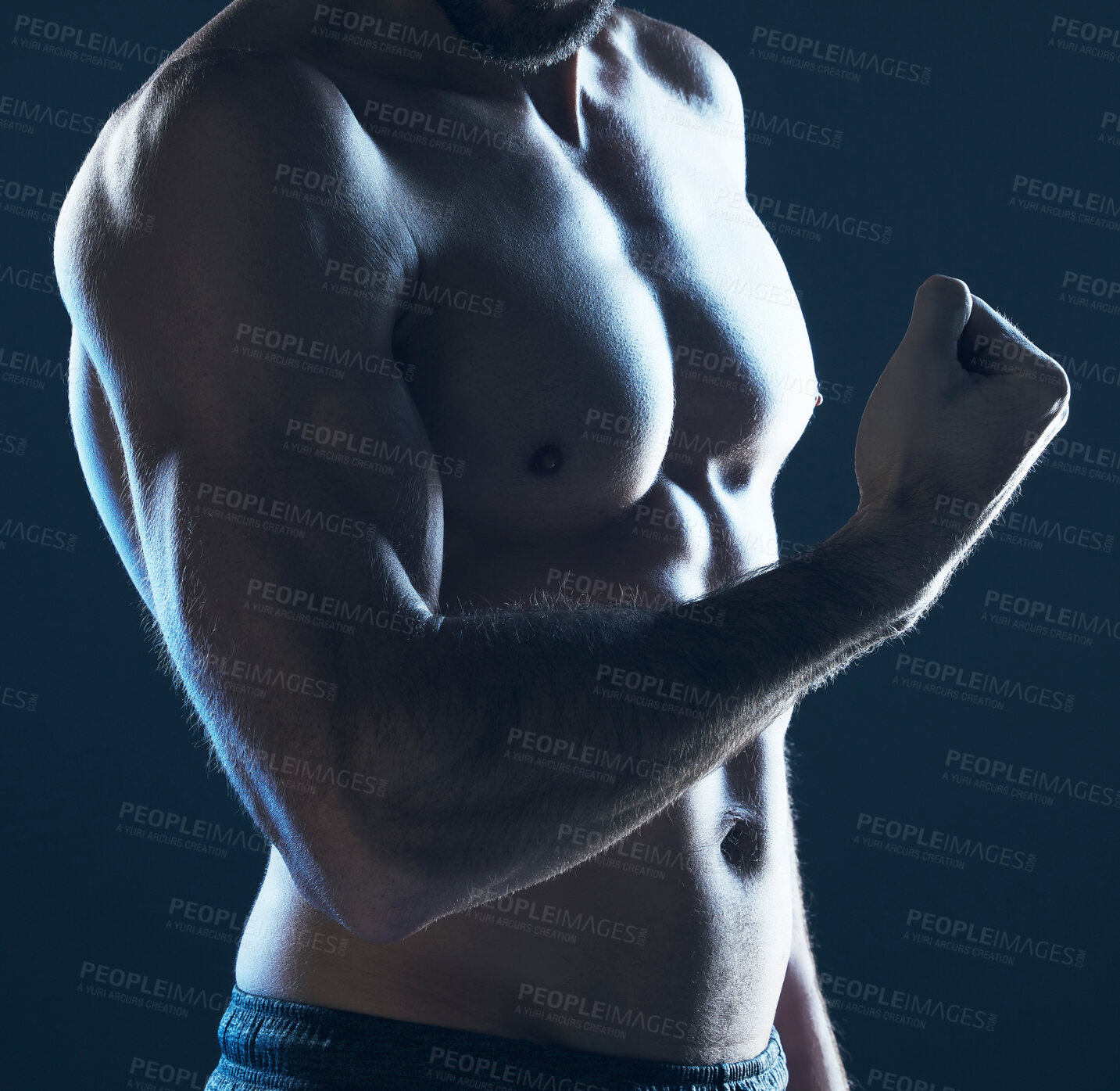 Buy stock photo Fitness, body and man flexing arm on blue background, isolated, neon blue light and muscular chest. Sports, muscle and topless male model in artistic dark studio for power workout and gym aesthetic.