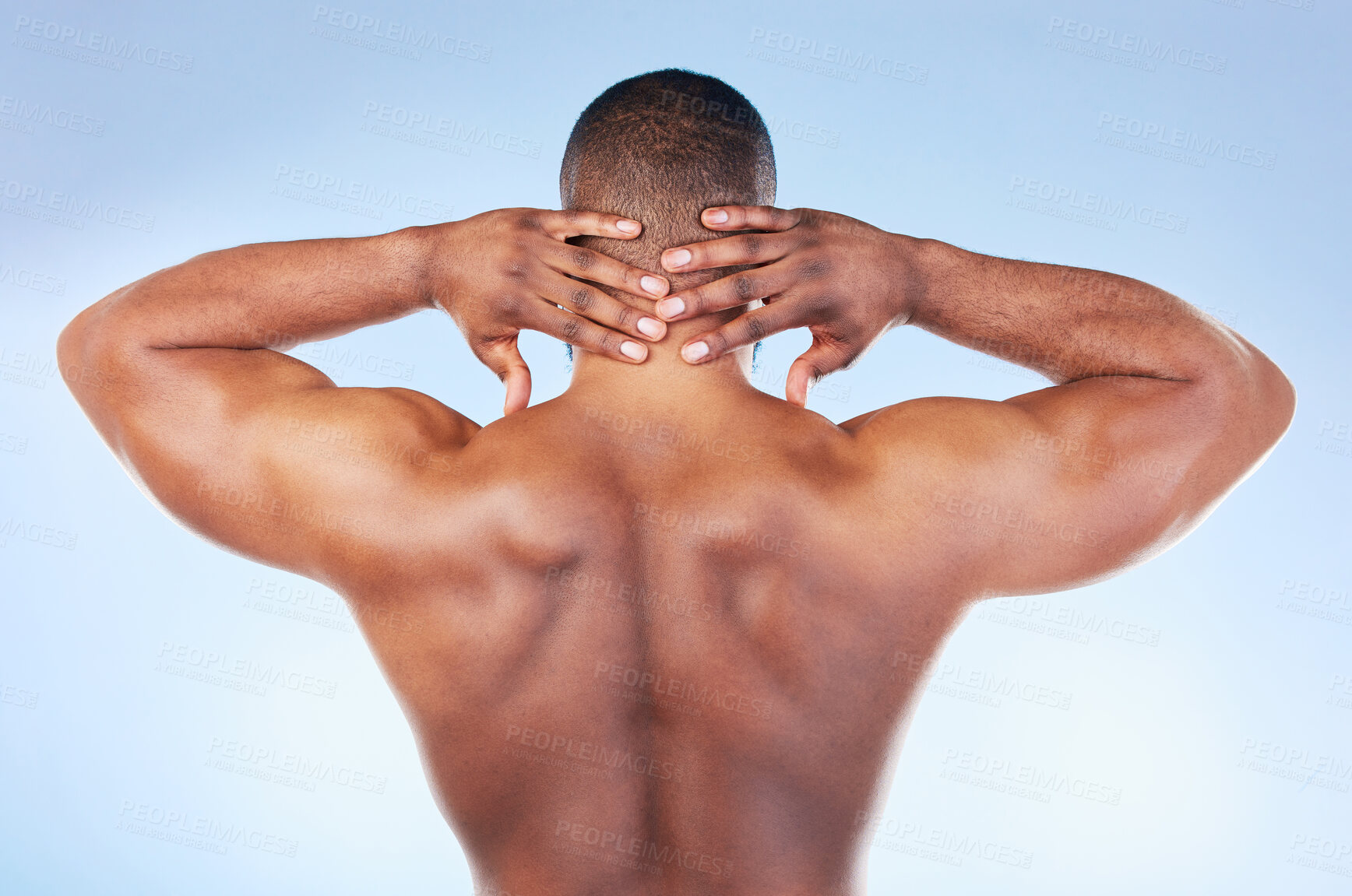 Buy stock photo Back, muscle and black man touching neck or head as self love, skincare and isolated in a studio blue background. Health, wellness and strong muscular bodybuilder or model embracing skin