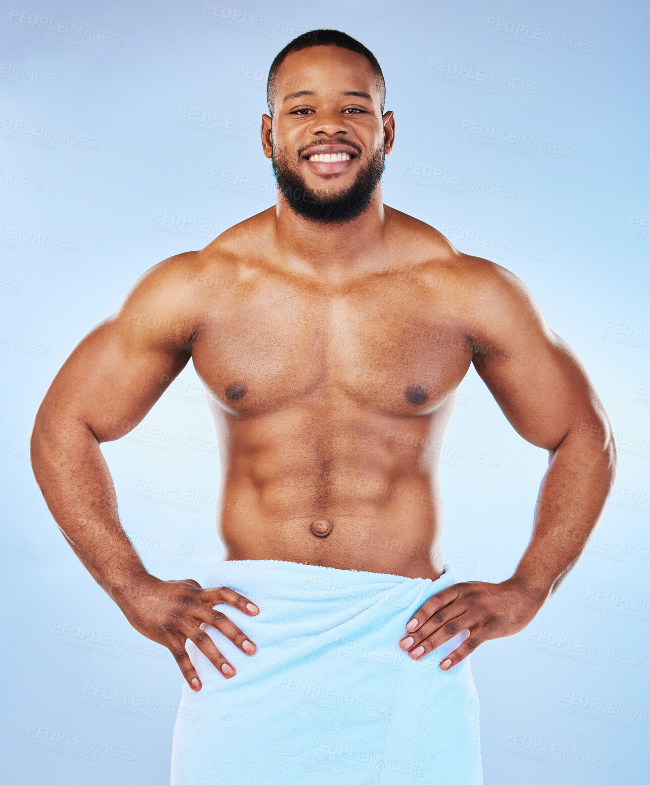 Buy stock photo Man body muscle, towel and portrait of a male smile with happiness from bodybuilder exercise. Cleaning, skincare and wellness after workout and fitness with isolated, studio and blue background