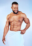 Towel, shower and fitness smile of a black man with happiness from bodybuilder muscle. Cleaning, skincare and wellness after sport workout and exercise with isolated, studio and blue background