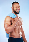 Black man, portrait and body towel with a smile in studio for health, wellness and fitness. Face of healthy male aesthetic model with clean skin, strong muscle and happiness on a blue background