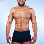 Black man in underwear, fitness and body with abs, healthy and active, muscle and strong on blue background, Shirtless male, exercise and bodybuilder, bare abdomen and workout with smile in studio