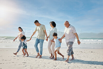 Buy stock photo Family, holding hands and walking outdoor on a beach with love, care and happiness for summer vacation. Parents, grandparents or travel with men, women and children together for holiday adventure