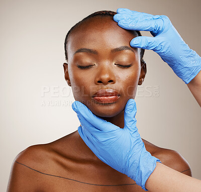 Buy stock photo Portrait, hands and plastic surgeon with a black woman patient in studio on a gray background for cosmetic change. Face, beauty and transformation with a young model getting ready for derma treatment