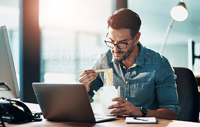 Buy stock photo Business man eating lunch at his desk, reading an email on a laptop and working overtime in office. Corporate professional, manager or employee completing a deadline and browsing internet for ideas