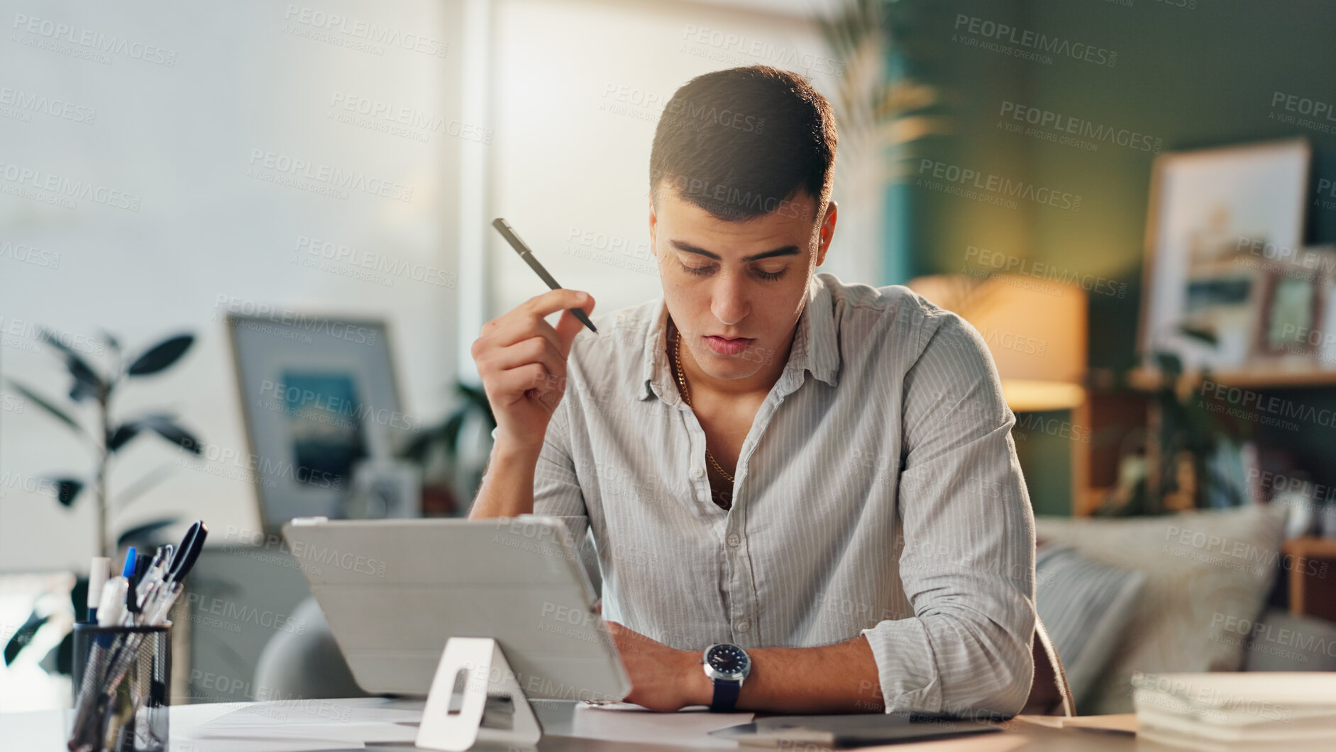 Buy stock photo Tablet, thinking and male designer at desk with idea, planning and time management for remote work. Freelancer, man and technology in home office for research, networking and feedback on internet