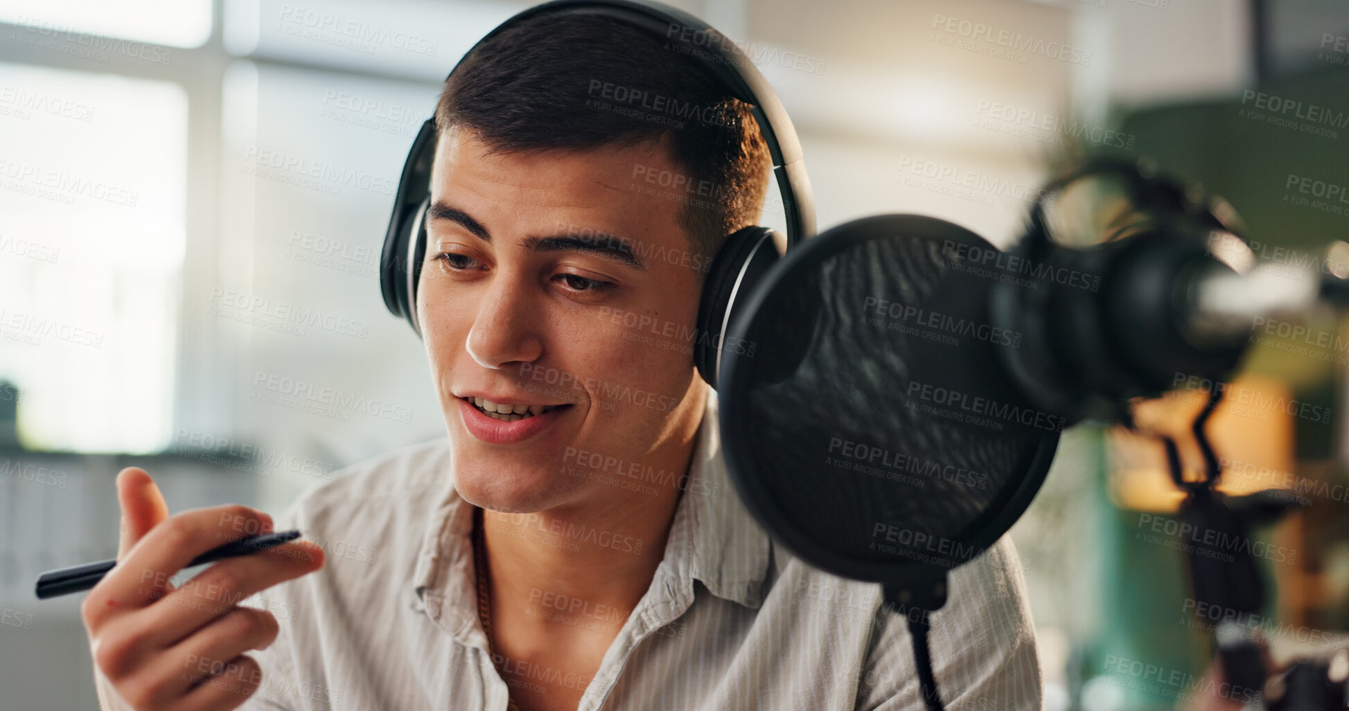 Buy stock photo Podcast, presenter and radio show host with man speaking about public relations and live streaming. Recording, microphone and headphone with interview discussion, audio and dj hosting in home studio