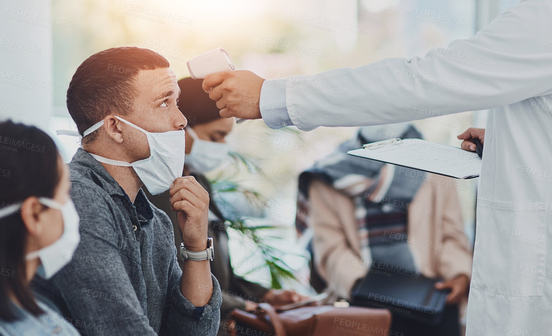 Buy stock photo Man, thermometer and mask for sick, virus and health safety with disease prevention regulation in clinic. People, pandemic and temperature for medical, compliance and wellness with healthcare worker