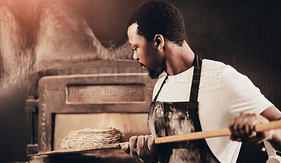 Buy stock photo Baker, bread and black man with oven, chef and confidence with small business, dough and healthy. African person, hobby and employee with nutrition, skills and talent with food, wheat and kitchen