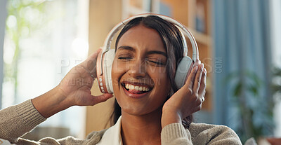 Buy stock photo Woman, face and happy with music headphones in home for streaming playlist, kpop artist and hearing sound. Girl smile, tech and listening to edm audio for favorite song, podcast and online radio