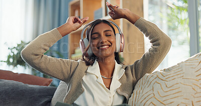 Buy stock photo Dance, woman and music with headphones on couch for radio, subscription and mobile app. Listening, streaming and happy female person in living room for sound, podcast and online audio on sofa in home