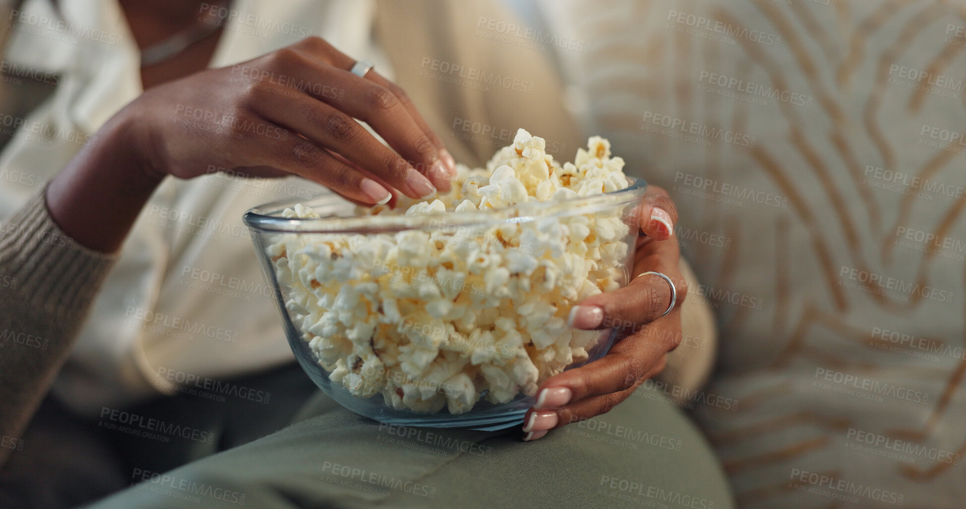 Buy stock photo Hands, girl and relax on sofa with popcorn for watching movies, streaming comedy film and unwind on weekend for break. Woman, closeup and snack in home for online subscription and entertainment.