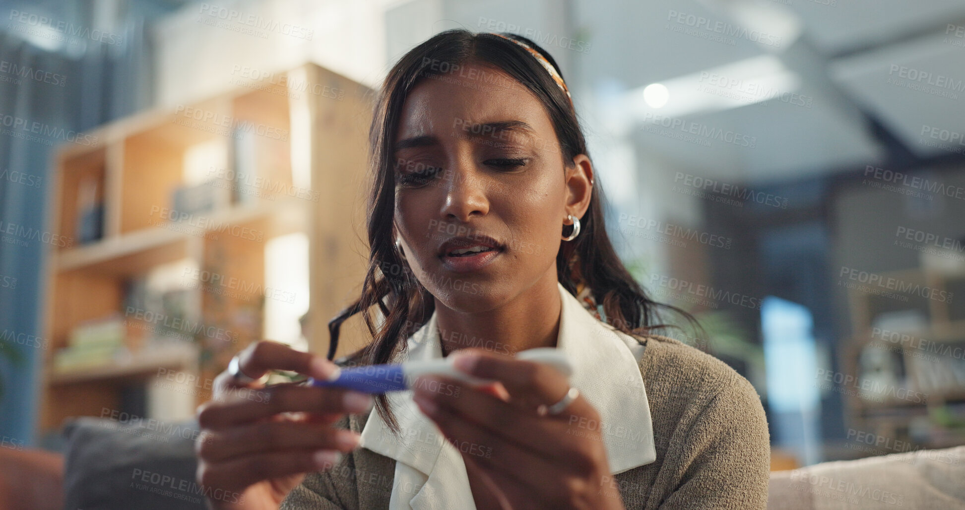 Buy stock photo Girl, home and sad with pregnancy test on couch for negative results on ovulation stick, unhappy and fertility concern. Woman, emotional and disappointed on sofa for trying to conceive and news.