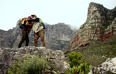 Buy stock photo Hiking, friends and men on mountain hug with backpack for adventure, trekking and fitness. Travel, nature and happy people outdoors for wellness, fresh air or exercise on holiday, freedom or vacation